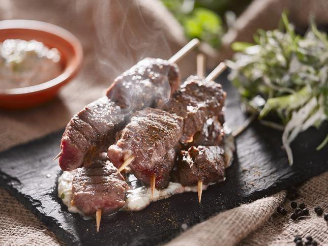 Lamb kebabs with herb salad