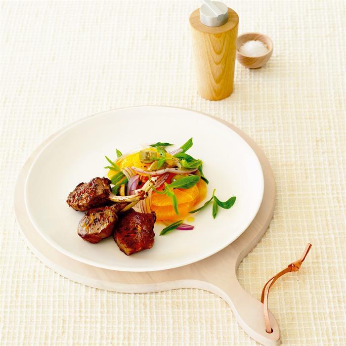 Grilled lamb cutlets with orange, onion and olive salad