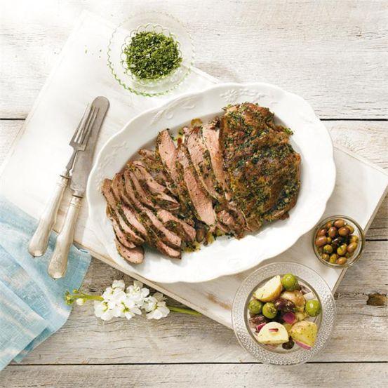 Barbecued butterflied lamb leg seasoned with parsley, capers and lemon