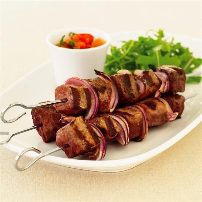 Char-grilled sirloin skewers with warm tomato vinaigrette