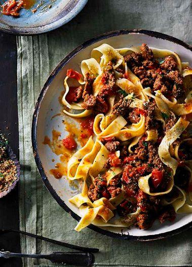 Beef sausage and cherry tomato ragu with pappardelle and toasted breadcrumbs