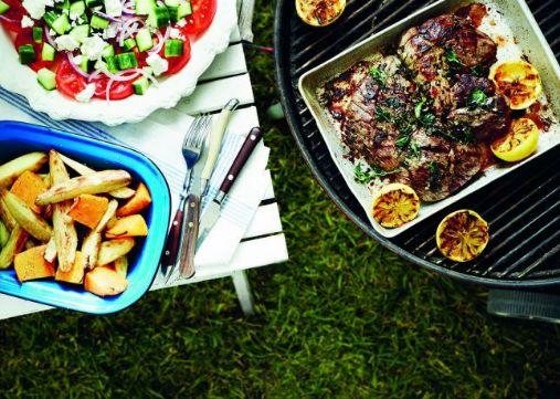 Greek-style butterflied leg of lamb with roasted vegetables and grilled lemon