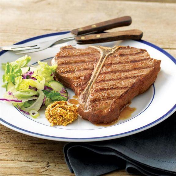 Barbecued steaks with garlic butter