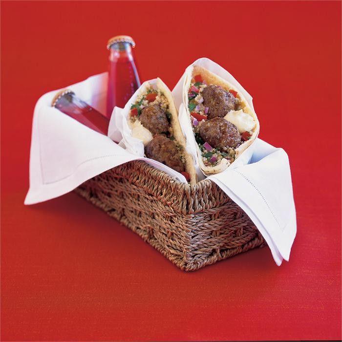 Lamb patties with pita bread, hummus and tabouli