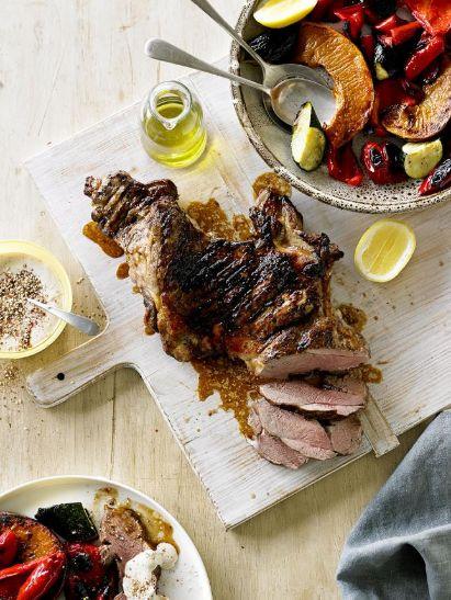 Barbecued butterflied lamb leg with roasted vegetables and tahini dressing