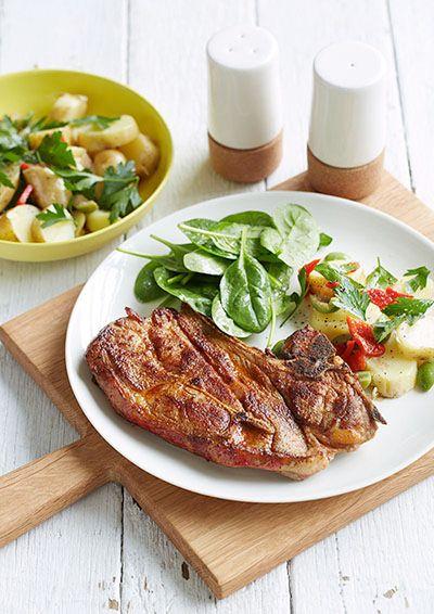 Smoked paprika chops with a potato, capsicum and olive salad