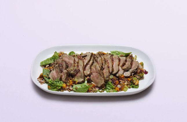 Barbecued lamb shoulder with lentil and spinach salad