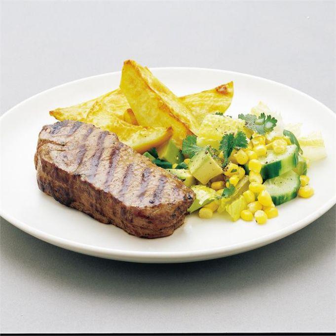Grilled steak with corn and cucumber salad