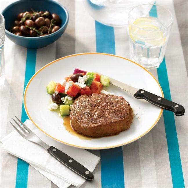 Barbecued scotch fillet steak with a greek salad