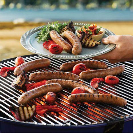 Barbecued beef sausages with sauces and salads