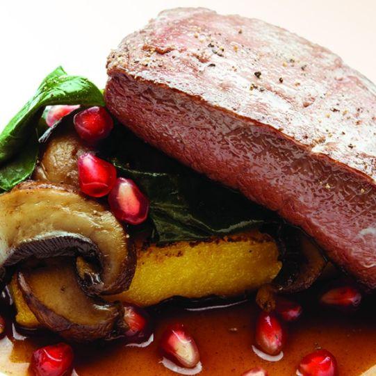 Australian oyster blade with polenta, portobello mushrooms, wilted greens and pomegranate balsamic vinaigrette